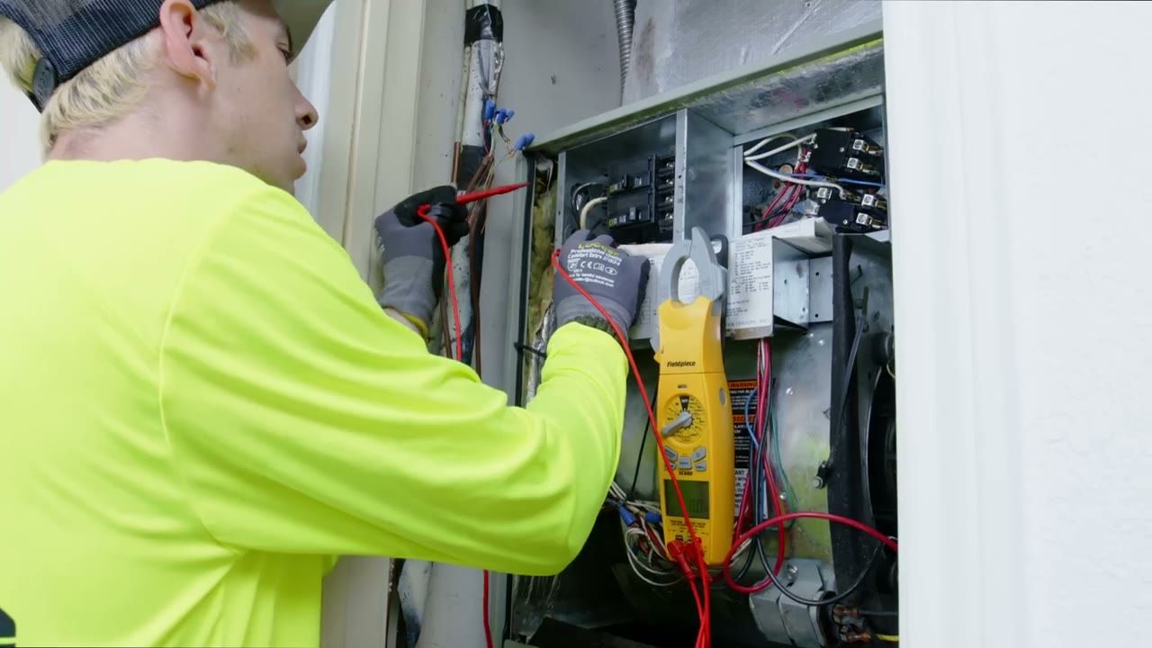 EMG technician testing a system during a maintenance visit