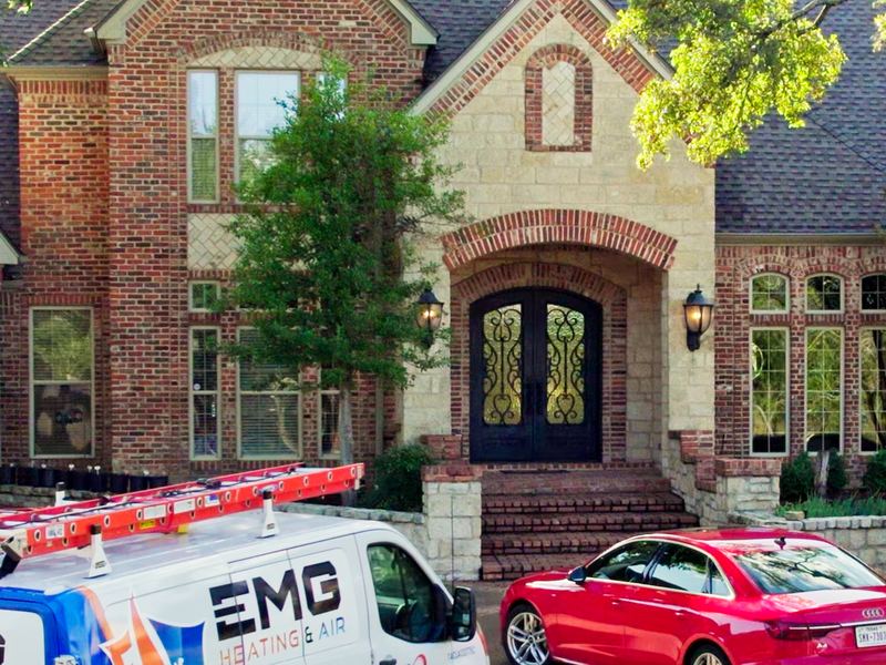 EMG Heating & Air van at a customer's home